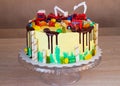 Children`s colorful fondant birthday cake decorated with little cars Royalty Free Stock Photo