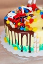 Children`s colorful fondant birthday cake decorated with little cars Royalty Free Stock Photo