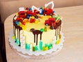 Children`s colorful fondant birthday cake decorated with little cars Royalty Free Stock Photo