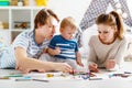 Children`s creativity. happy family mother father and son draw Royalty Free Stock Photo