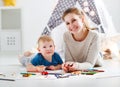 Children creativity. mother and baby son drawing together Royalty Free Stock Photo