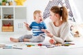 Children creativity. mother and baby son drawing together Royalty Free Stock Photo