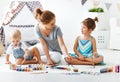 Children`s creativity. mother and children draw paints in play Royalty Free Stock Photo