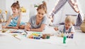 Children`s creativity. mother and children draw paints in play Royalty Free Stock Photo