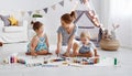 Children`s creativity. mother and children draw paints in play Royalty Free Stock Photo