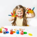 children\'s creativity. Portrait cheerful  laughing caucasian preschool little girl with face and hands painted at home Royalty Free Stock Photo