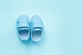 Children's denim sports shoes for boys stands on blue background. Close-up sneakers top view. Baby clothes concept. Royalty Free Stock Photo