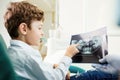 Children`s dentistry. A child in the dental office