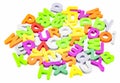 Children`s developmental training toys. Beautiful plastic characters on a white background