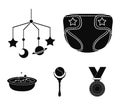 Children`s diapers, a toy over the crib, a rattle, a children`s bath. Baby born set collection icons in black style