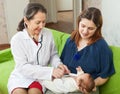 Children's doctor examining newborn baby Royalty Free Stock Photo