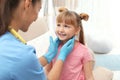 Children`s doctor visiting little girl Royalty Free Stock Photo