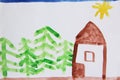 Children`s drawing of house and green spruces