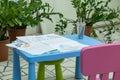 Children's drawings in pencil on a table.