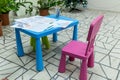 Children's drawings in pencil on a table.