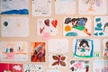 Children`s drawings on the wall in the room