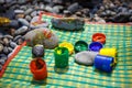 Children`s entertainment on a pebble beach-paint stones.