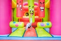Children`s fair with inflatable castles for jumping and bouncing, children having a good time