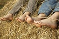 Children's feet in the hay Royalty Free Stock Photo
