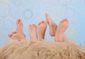 Children's feet over furry blanket Royalty Free Stock Photo
