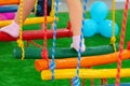 Children`s feet at the playground with swinging bridge Royalty Free Stock Photo