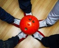 Children`s feet in shoes and a bowling ball Royalty Free Stock Photo