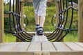 Children`s feet in sneakers and shorts at the playground Royalty Free Stock Photo