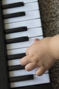 Children`s fingers on the keys of a piano playing Royalty Free Stock Photo