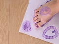 Children`s foot with a drawn heart. Royalty Free Stock Photo