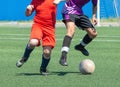 Children's football. The boys are recklessly fighting for the ball