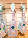 Children's four-string guitars, painted in a multicolored. A musical instrument. Royalty Free Stock Photo