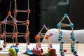 Children`s game building construction with toothpick sticks and plasticine balls close up still