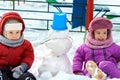 Children's game in snow outside, winter holidays, games and have fun. Little Children Kids Boy and girl, brother sister Royalty Free Stock Photo