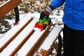 A child plays with a toy at the first snow. Royalty Free Stock Photo