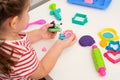 Children`s games with plasticine, children`s hands with plasticine snails, creative games, playing dough