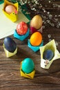 Childrens gift Easter egg wrapping on a wooden table. Handmade.