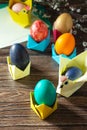 Childrens gift Easter egg wrapping on a wooden table. Handmade.