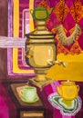 Children`s gouache painting `Decorative still life with a samovar on the table`