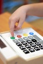 Children`s hand presses on button calculator Royalty Free Stock Photo