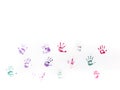 Children's hand prints on white wall