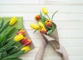 Children`s hands collect a bouquet as a gift. A gift for mom. Royalty Free Stock Photo