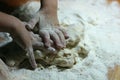 Children`s hands and dough. Little boy kneading a dough. Healthy handmade food concept. bakery products, pizza, flour. cooking Royalty Free Stock Photo