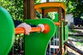 Children`s hands hold the pipe in the playground. Close-up Royalty Free Stock Photo