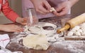 Children's hands holding a dough for molding dumplings Royalty Free Stock Photo