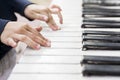 Children`s hands on the keys of the piano. Piano lessons for kids