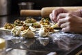 Children`s hands are making Homemade Asian dumplings with vegetable filling on a black granite table, Chinese dumplings for dinne Royalty Free Stock Photo