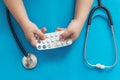 Children`s hands with medicines. Left unattended child plays with dangerous pills Royalty Free Stock Photo