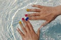 Children`s hands with multi-colored manicure Royalty Free Stock Photo