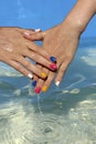 Children`s hands with multi-colored manicure Royalty Free Stock Photo