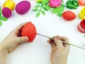 Children`s hands paint Easter eggs. The child is drawing. Easter. Royalty Free Stock Photo